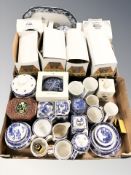 A collection of Ringtons blue and white caddies, jugs, dishes, tins,