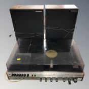 A National Panasonic SG-1070 L music system and a pair of speakers