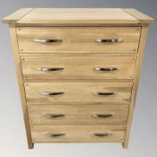 A modern oak five drawer chest,