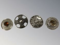 Four silver Celtic brooches