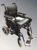 A Sunrise Powertec mobility wheel chair with manual