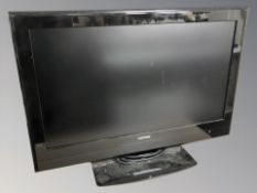 A Vistron 32 inch LCD TV with lead and remote