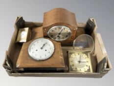 An inlaid mahogany mantel clock with silvered dial,