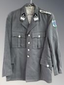 An Austrian military tunic, a later reproduction, green, with lapel patches and shoulder patch,