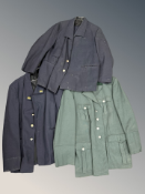 Two railway tunics, one with trousers,