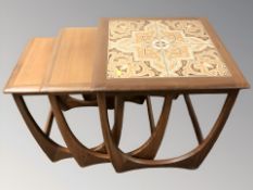 A G-Plan teak tile inset nest of three tables,