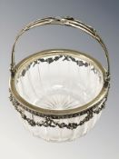 An ornate silver-gilt mounted crystal basket,