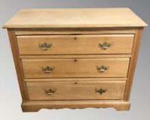 A late Victorian satinwood three drawer chest,