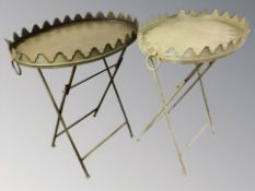 A pair of reproduction oval tin occasional tables,