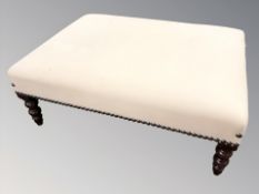 A reproduction rectangular footstool,