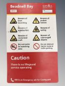 A Berwick Upon Tweed Borough Council Beadnell Bay fibreglass warning sign, 80 cm x 50 cm.