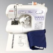 A Janome sewing machine 3050 with lead and instructions