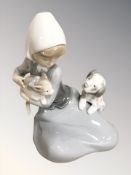A Lladro figure of girl with puppy and cat