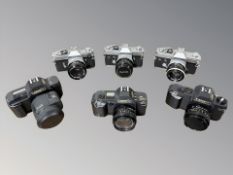 A collection of 35mm SLR cameras to include Canon T80 with Canon zoom lens AC 35-70mm 1: 3.5-4.