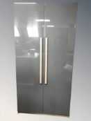 A modern grey laminated double door wardrobe,