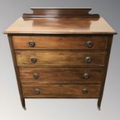 An Edwardian satinwood inlaid four drawer chest,