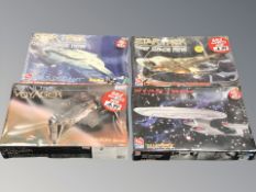 Three Ertl Star Trek Deep Space Nine modelling kits and a further Monogram Star Trek Voyager model