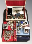 A modern jewellery box containing dress rings, cufflinks,