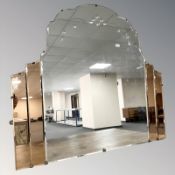 An Art Deco clear and peach glass overmantel mirror,