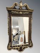 An early 20th century walnut and gilt gesso pier glass mirror in the Regency style,