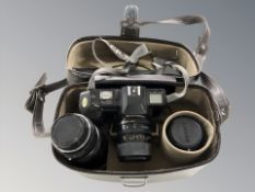 A camera bag of Chinon CP-7M camera with 28-70mm lens,