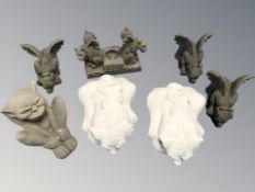 Seven various composition gargoyles including a tea light holder (one box)