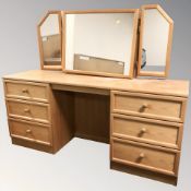 A modern teak twin pedestal dressing table,