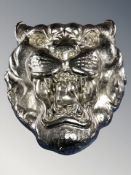 A silvered resin tiger's head wall plaque,