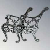 A pair of painted cast iron bench ends