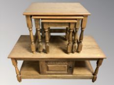 A reproduction oak storage coffee table,