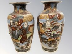 A pair of early 20th century Japanese Satsuma earthenware vases, height 39cm.