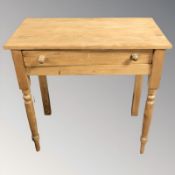 A pine single drawer side table,