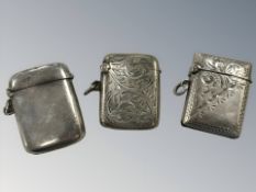 Three antique silver vesta cases, largest 4 cm long. CONDITION REPORT: 50.4 gross.