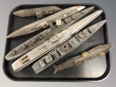 A group of 20th century wooden model ships and submarines