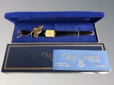 A lady's Oleg Cassini gold plated quartz diamond set wrist watch in box,