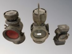 Two Lucas lamps and another smaller lamp,