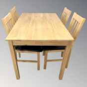 A contemporary oak dining table,