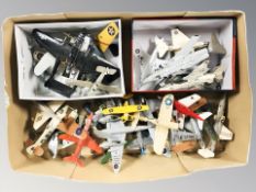 A group of die cast scale model aircraft.