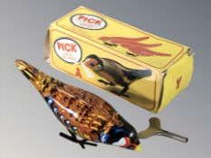 A Pick tin plate wind up bird model in box.