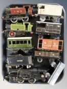 A group of tin plate locomotives and tenders including Lionel.