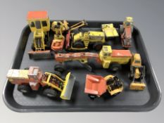 A group of 20th century Dinky die cast construction vehicles including earth movers, steam roller,