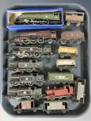 A group of 20th century tin plate locomotives and passenger cars including Meccano.