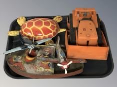 A group of tin plate die cast models including air craft, boat,