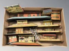 A group of tin plate model railway station platforms and buildings
