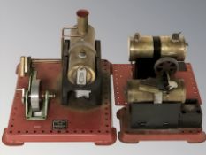 Three Mamod live steam boilers on plinths.