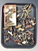A group of painted die cast metal horses, cavalrymen, soldiers.