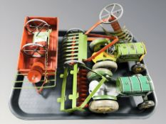 Two Mettoy tin plate tractors with plowing attachments, further wagon, etc.
