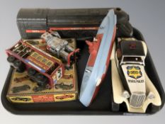 A tin plate wind up robot, two Merit racing car modelling kits, model locomotive, etc.