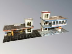 A 20th century tin plate model city heliport and a further Shell service garage,