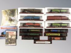 A group of die cast scale model locomotives on plinths.